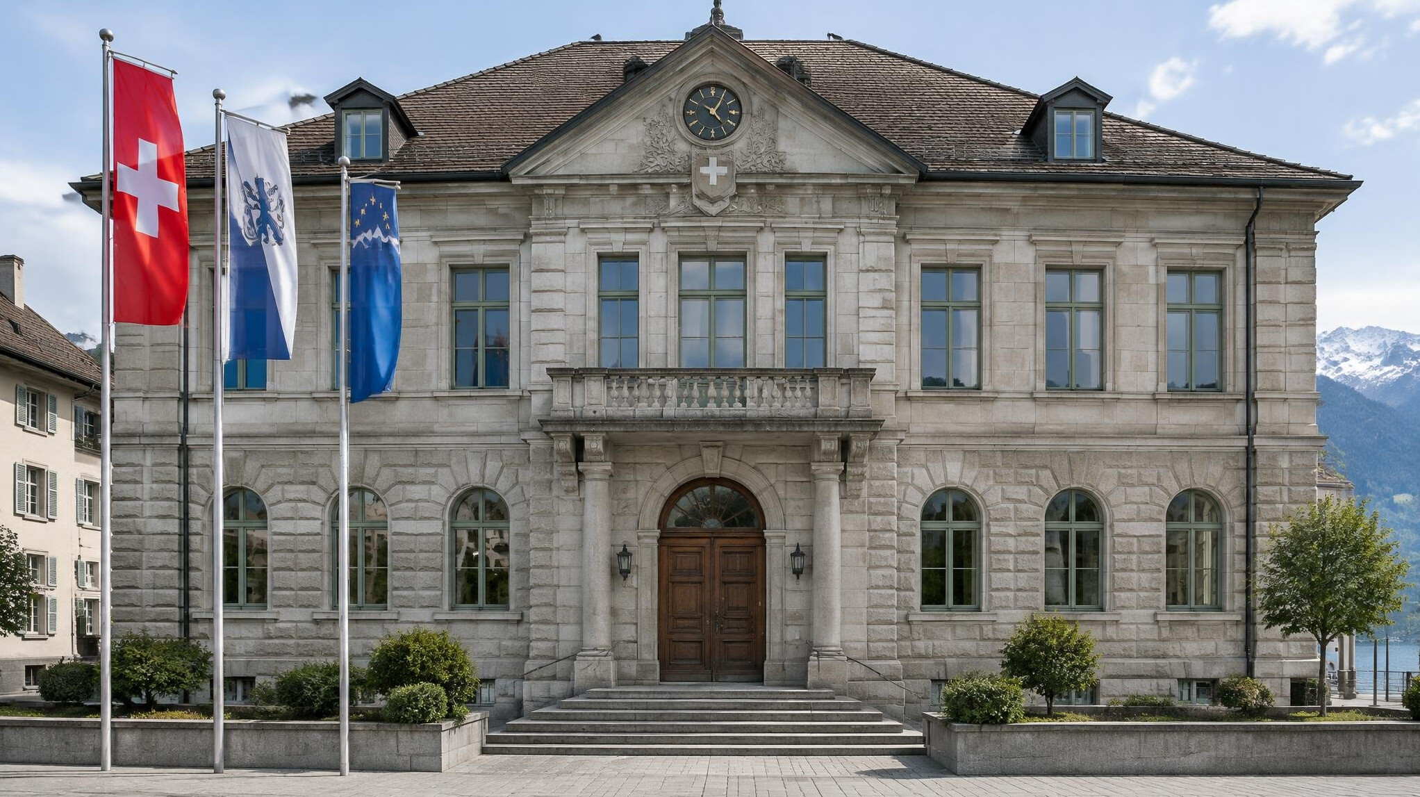 Facade of a Swiss administrative building with flags