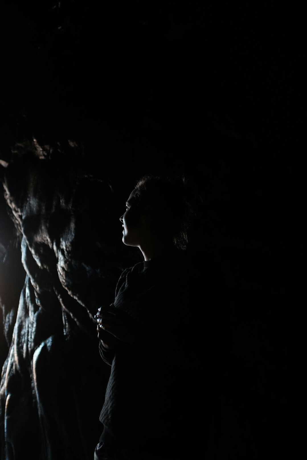 person exploring cave
